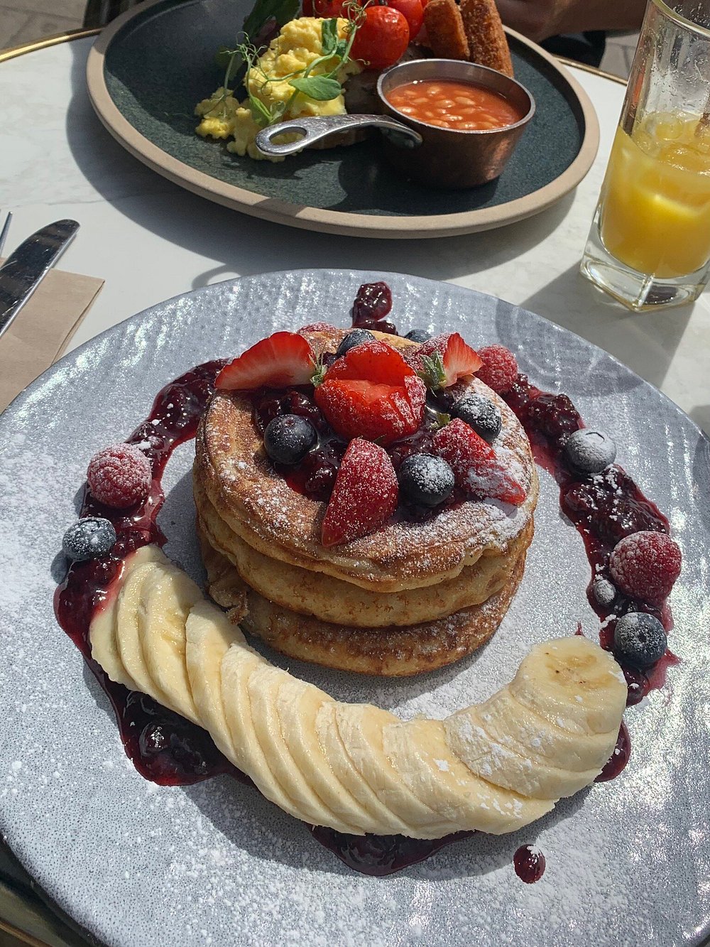 Pancakes with fresh berries and banana