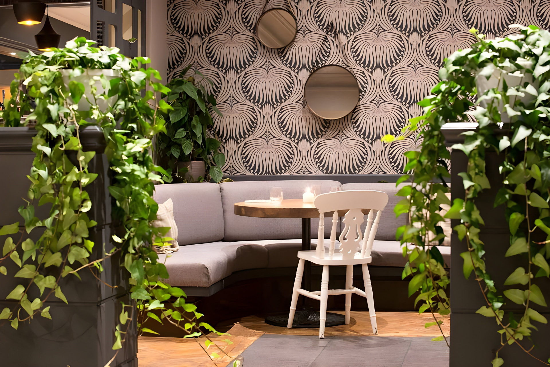 The brasserie at SIX, with dining tables and greenery